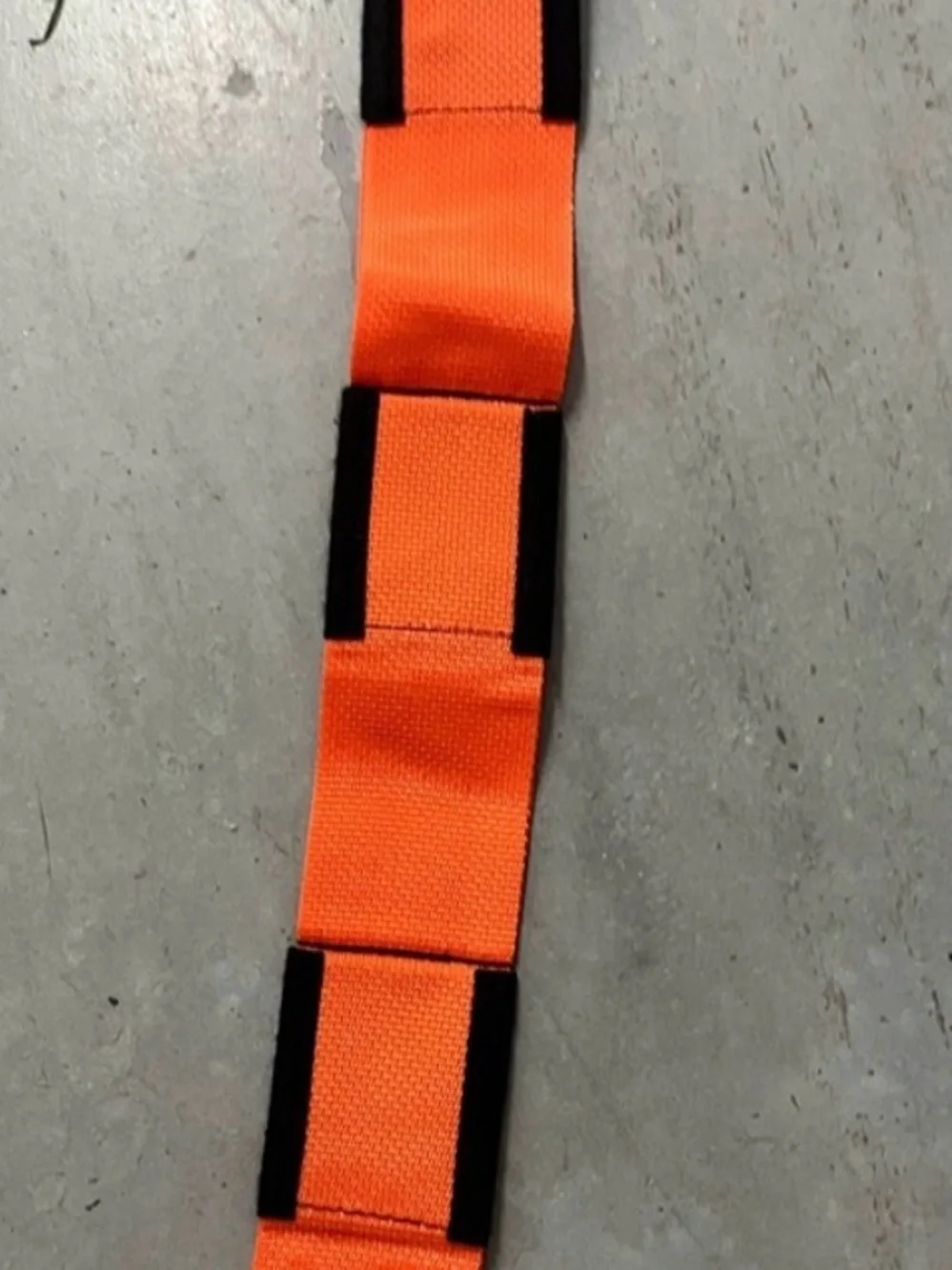 2 Orange and Black Forearm Forklift Moving Straps